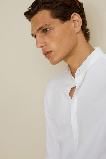 MANGO men's white button-up shirt, partial front close-up, button placket
