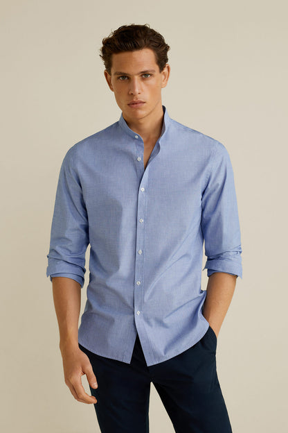 Men’s light blue button-down shirt with long sleeves and buttoned collar