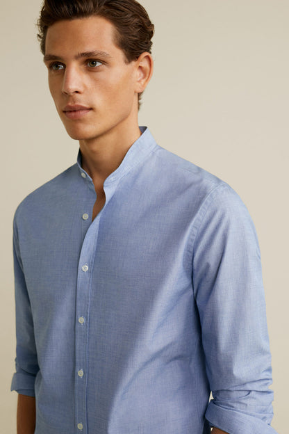 Men’s light blue button-down shirt close-up, buttoned front and collar