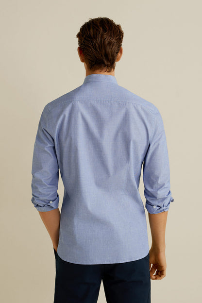 Men’s light blue button-down shirt shown from the back, long sleeves