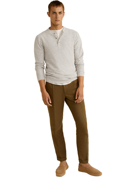 Beige long-sleeve henley shirt with button placket and long sleeves