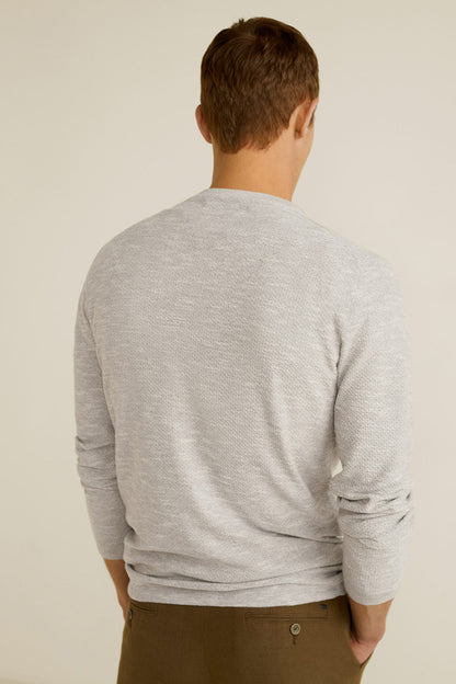 Beige long-sleeve henley shirt, back view