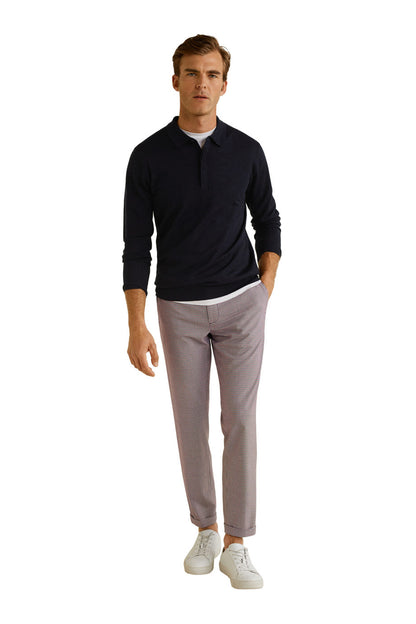 Men's red and blue check trousers with a tapered fit and white sneakers