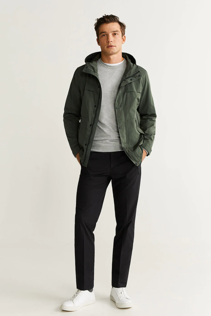 Men's dark khaki hooded jacket with button front, worn with dark trousers