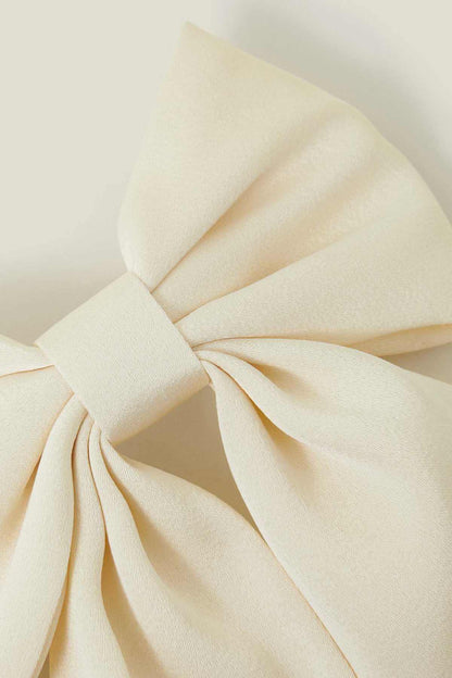 Cream fabric bow knot with layered long tails