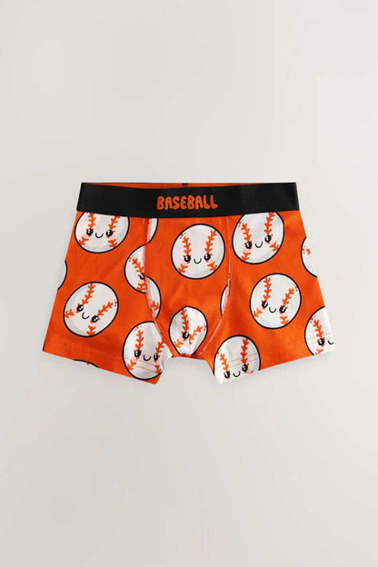Kids boxer shorts with orange baseball ball print on orange background and black waistband