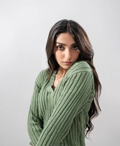 Green rib-knit V-neck sweater detail with long sleeves and fitted shoulders