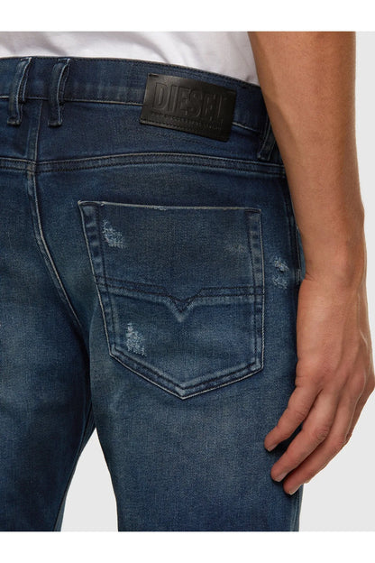 Blue denim jeans close-up of back yoke and stitched pocket
