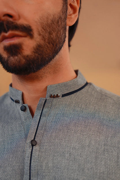 Men's blue-gray yarn-dyed kurta collar close-up, black-trimmed neckline buttons