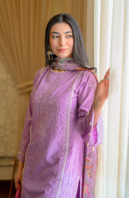 Light purple embroidered kurta with ornate front panel and neck detail, standing pose.