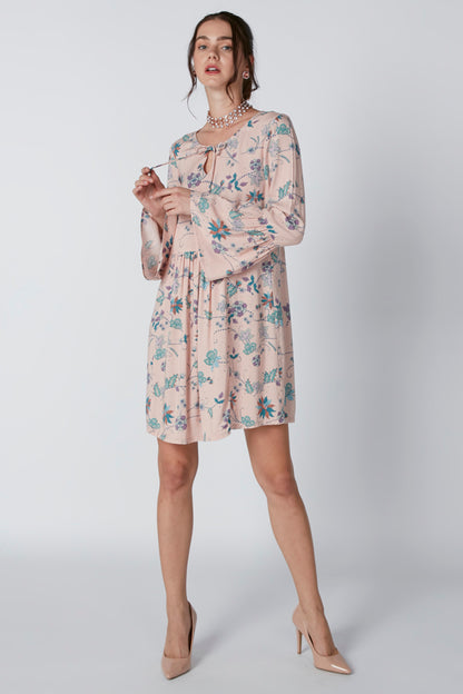 Pink floral long-sleeve mini dress with tied neckline and tiered skirt