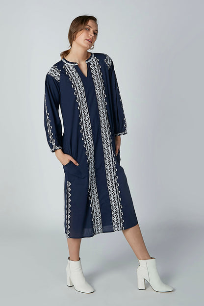 Navy long-sleeve midi dress with white embroidered front panels and side slit