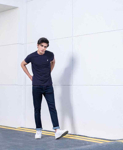 Navy fitted crew-neck T-shirt, short sleeves, small chest logo, side view