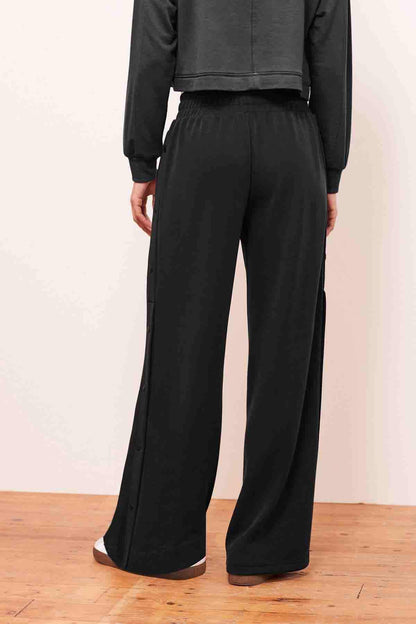 Charcoal grey wide-leg trousers with elastic waistband