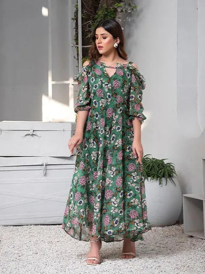 Floral midi dress side view with off-shoulder neckline, green base and pink flower print