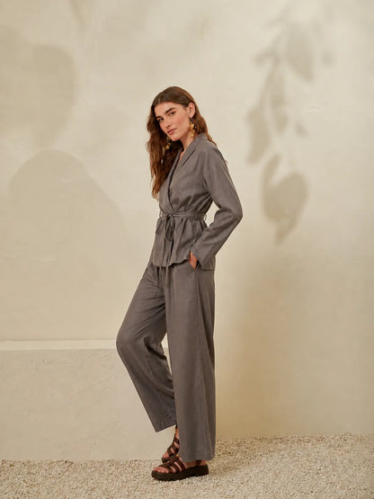 Grey wrap V-neck jumpsuit with long sleeves and drawstring tie waist