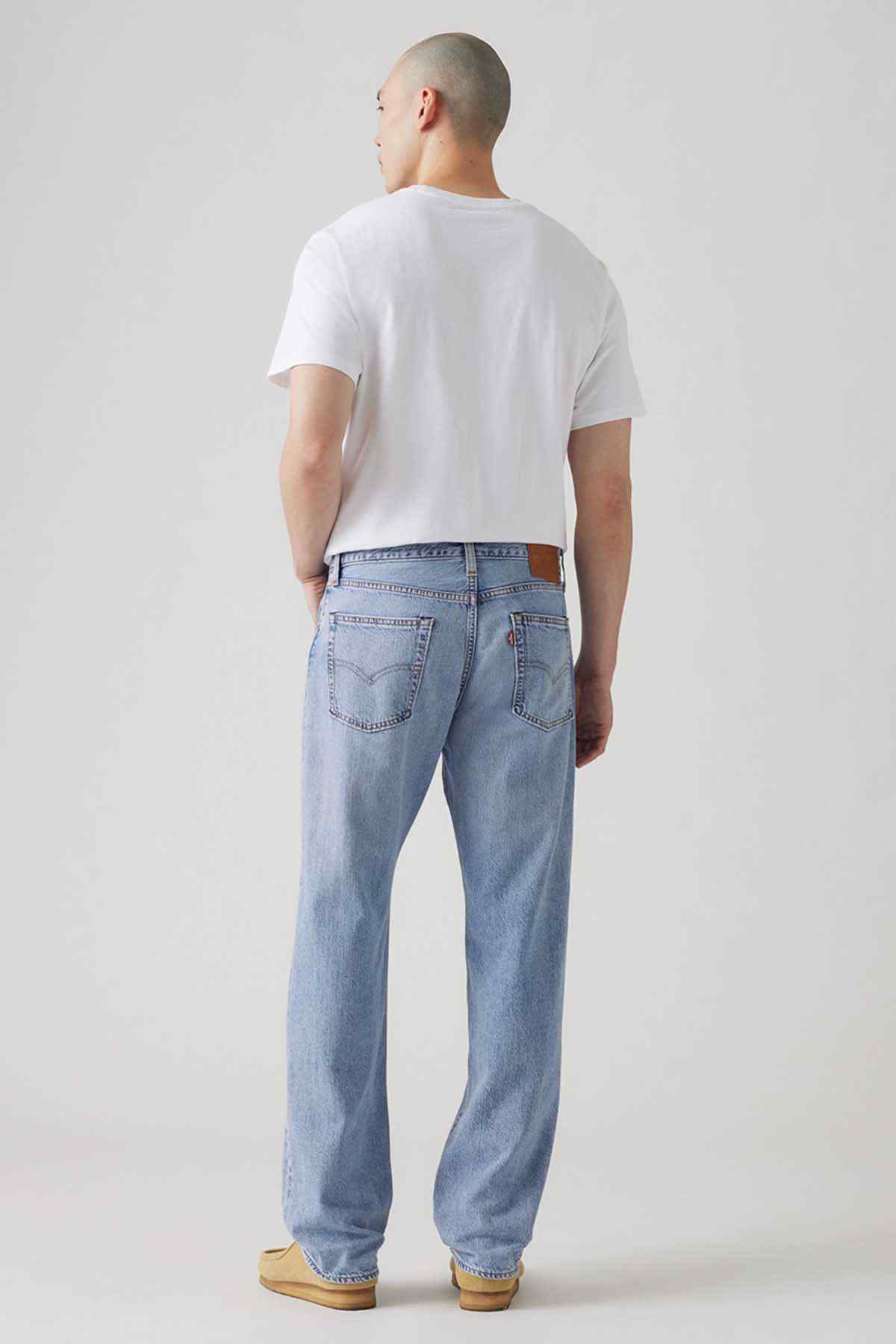 Light indigo denim jeans, back view with two rear pockets and straight legs