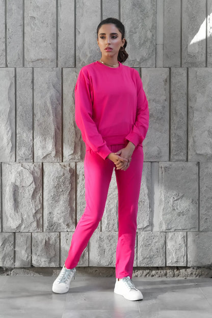 Women's fuchsia tracksuit jogger pants with cuffed hems and long sleeves