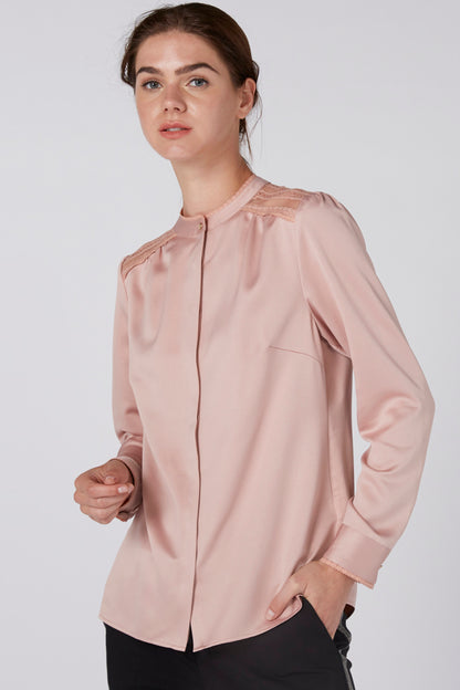Light pink zip-front blouse with stand collar, lace-trim yoke, chest pocket