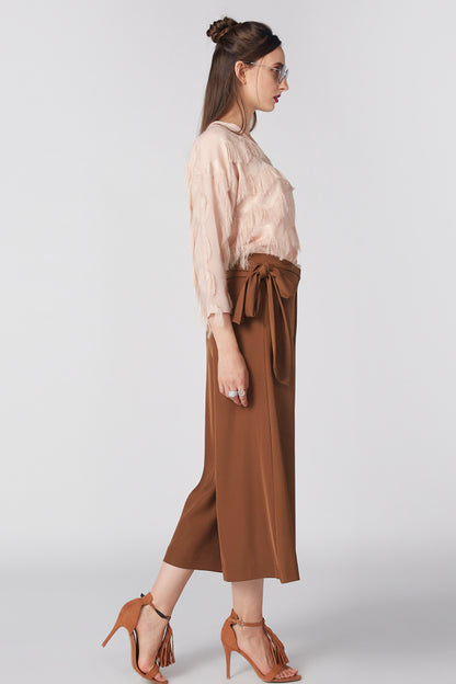 Beige fringe blouse with ruffled details and V-neck, long sleeves, side view