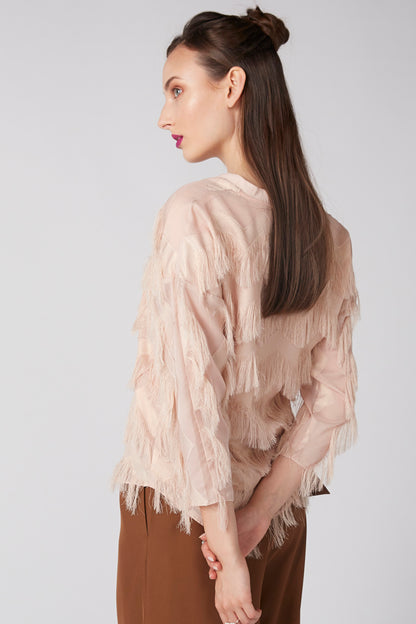 Beige fringe blouse with tassel trim and V-neck, long sleeves