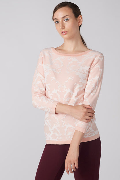 Women's pink long-sleeve top with light abstract print, crew neckline
