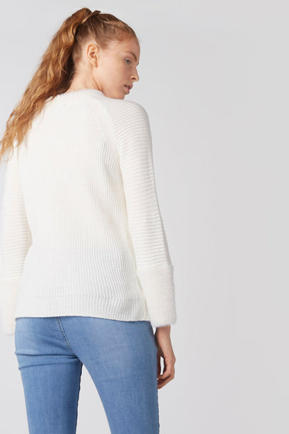 White knit crewneck sweater side view with long sleeves and ribbed hem