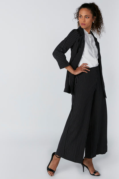 Black pinstripe wide-leg trousers with shirt-friendly tailored waistband