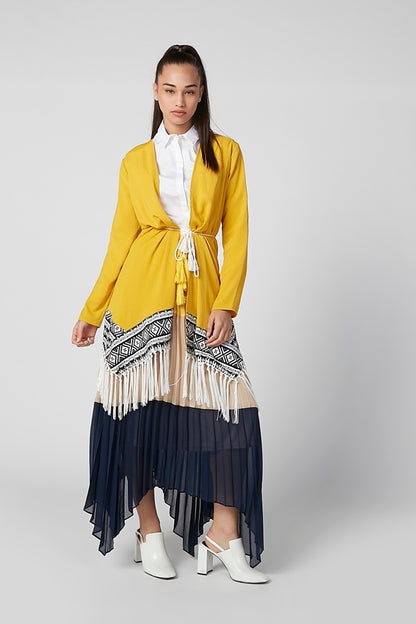 Yellow boho dress with patterned border and layered navy skirt, long sleeves