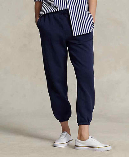 Navy fitted jogger pants with elastic waistband and cuffed hems