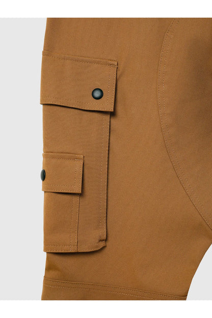 Brown cargo pants close-up of flap pocket with snap and black button