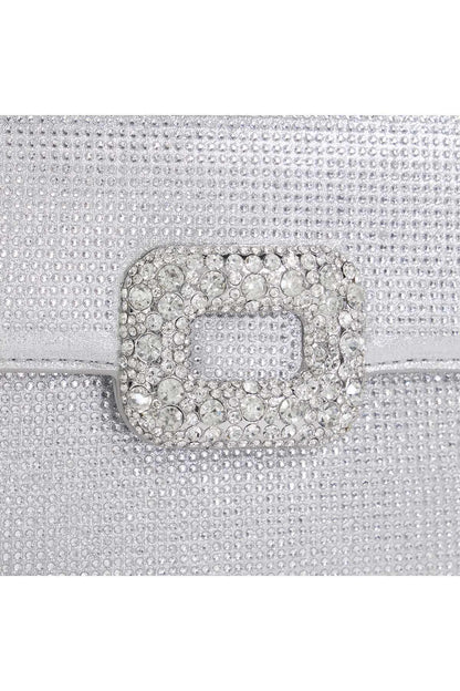 Silver handbag flap close-up with crystal buckle and textured rhinestone finish
