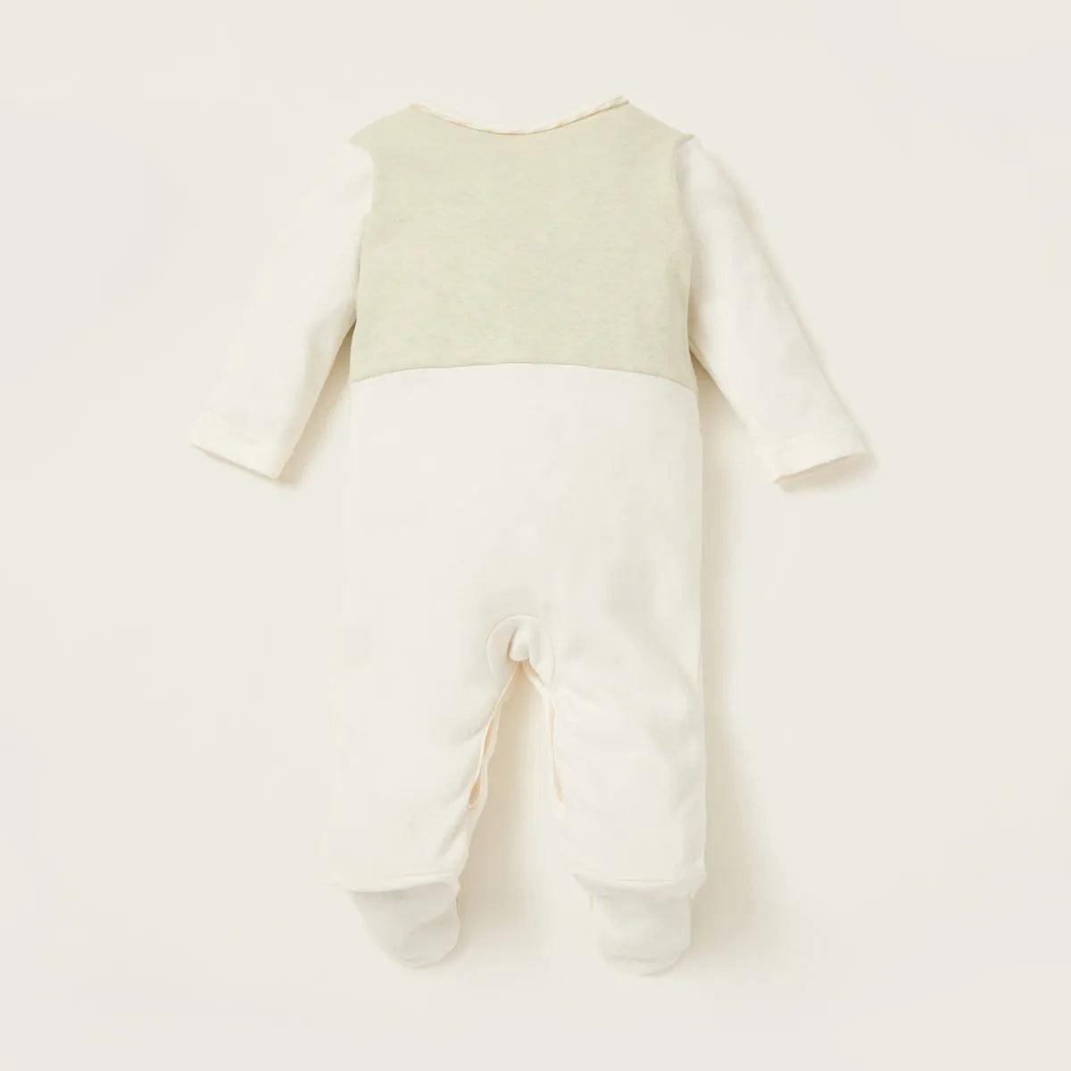 Off-white baby footed romper with long sleeves and cross-over leg panel detail
