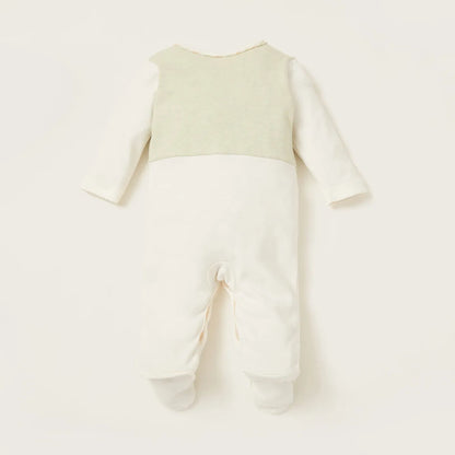 Off-white baby footed romper with long sleeves and cross-over leg panel detail