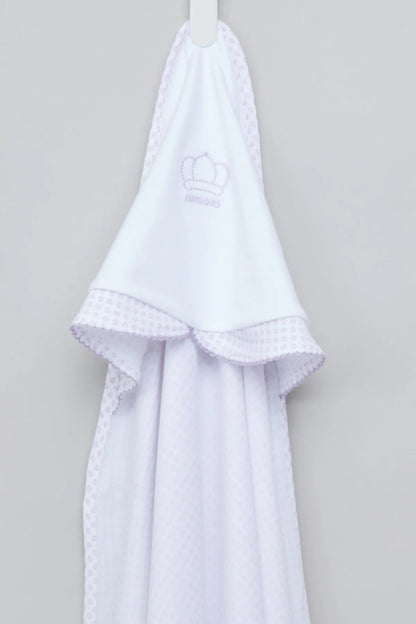 White hooded towel with small logo, lace trim, and ruffled hem