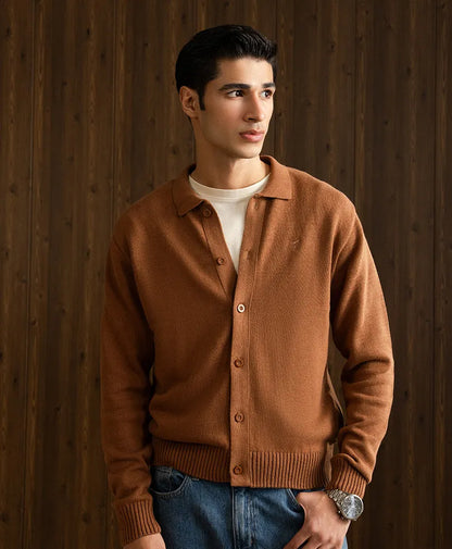 Men's fitted brown cardigan with pointed collar and button front, standing