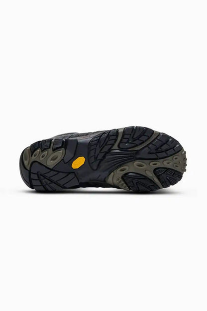 Hiking shoe outsole with deep tread and textured rubber traction pads