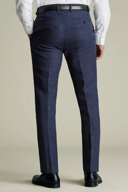 Navy dress trousers with belt loops and pressed crease, full length view