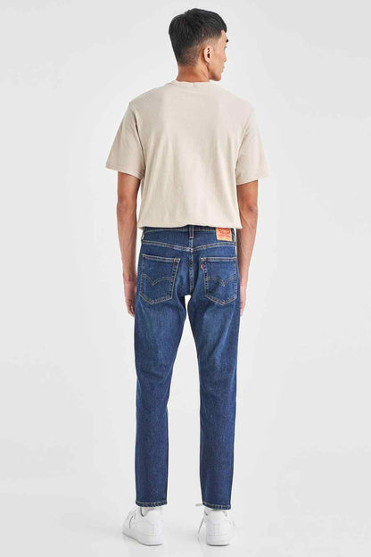 Levi's dark indigo jeans back view with rear yoke and straight-leg hems