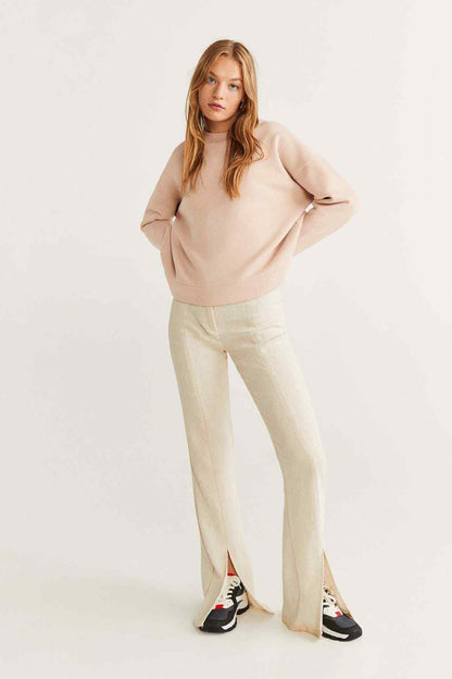 Light pink crewneck sweatshirt with long sleeves and ribbed cuffs, full view