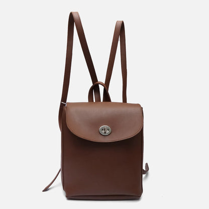 Brown leather mini backpack with front flap clasp and raised top handle; adjustable straps.