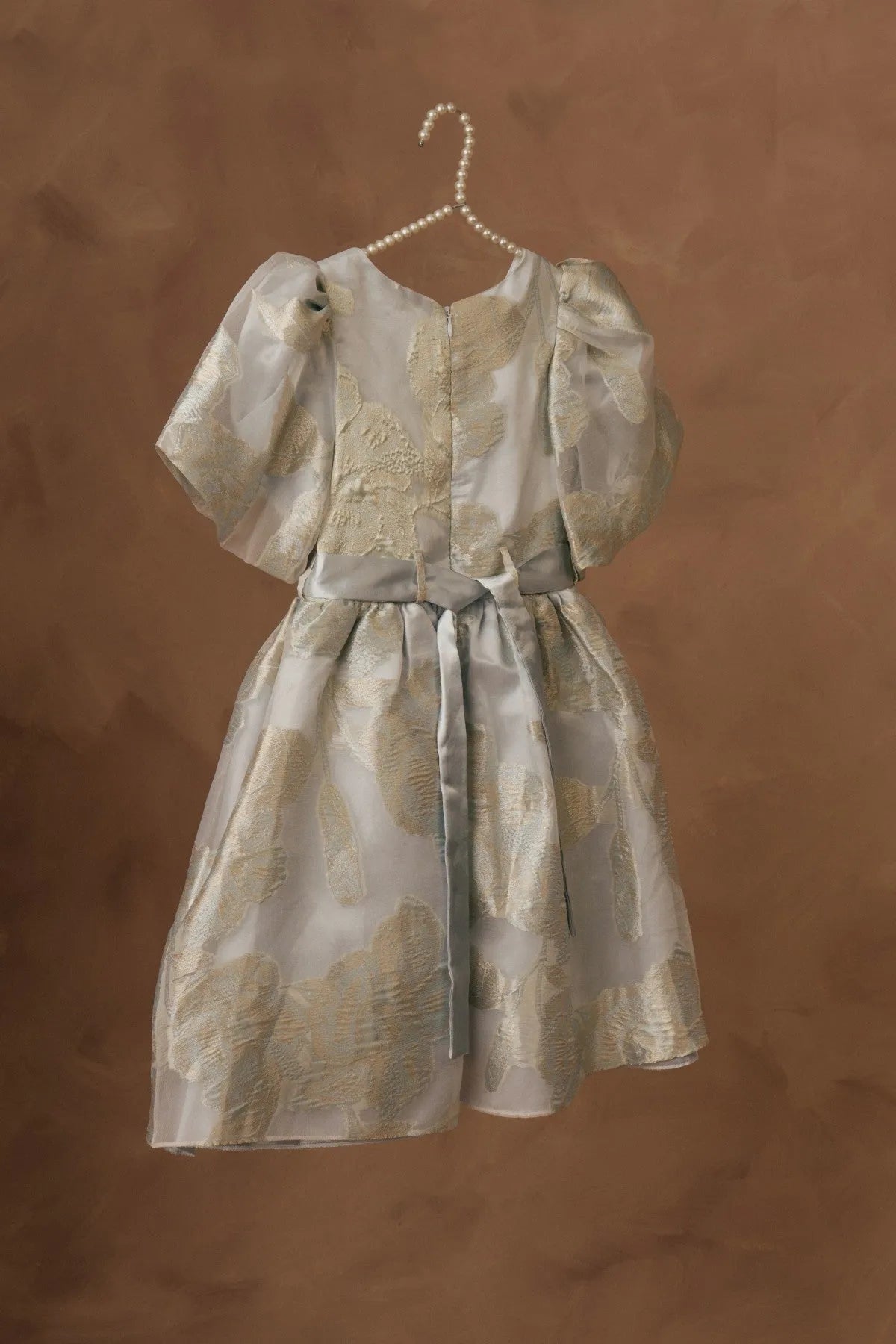 Licci girls cream dress with gold animal print, short puff sleeves and sash tie