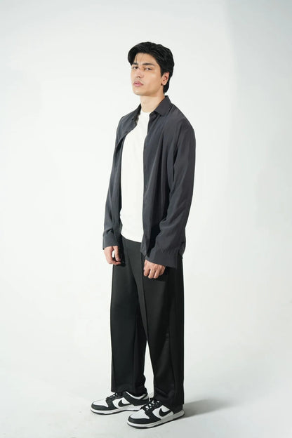 Black relaxed-fit trousers with elastic waistband and full-length wide legs
