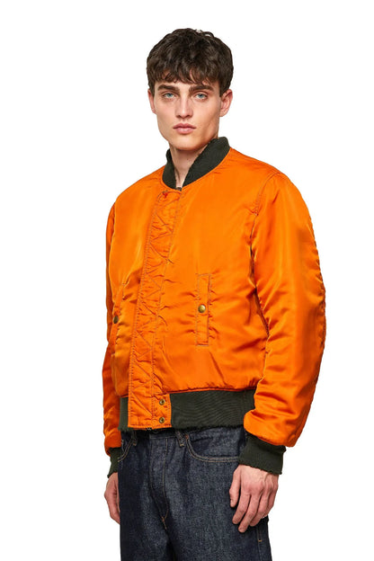 Orange bomber jacket with front zipper, snap buttons, ribbed cuffs and hem