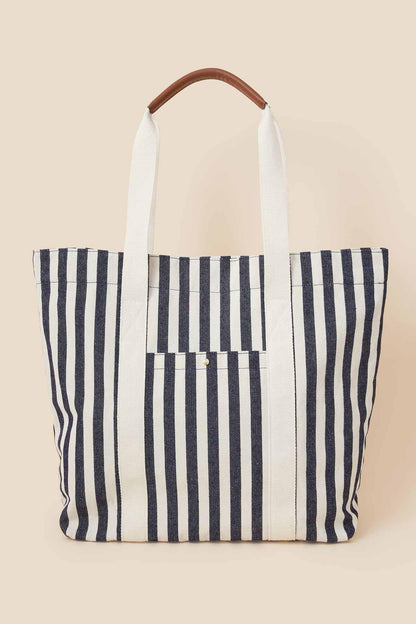 Navy and white striped canvas tote bag with tall handles and front pocket