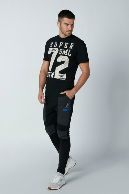 Black colorblock jogger pants with side logo patch and tapered fit