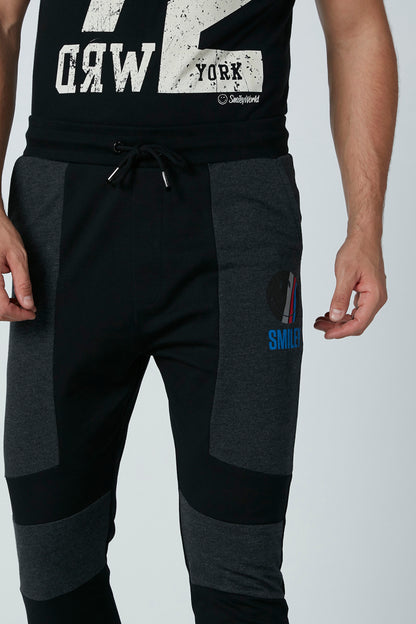 Black colorblock jogger pants, front drawstring and stitched utility pocket