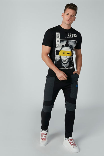Black graphic crewneck T-shirt with face and yellow mask graphic