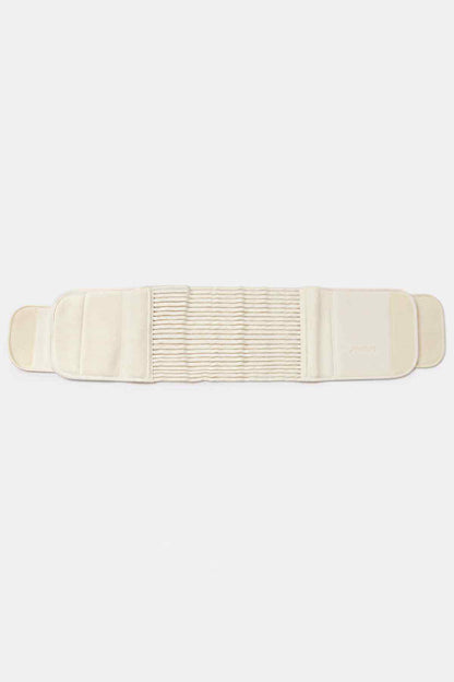 Cream belly support belt laid flat, padded wrap with elastic rib middle