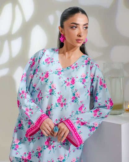 Dhaga floral kurta pajama set close-up: light blue top with pink floral print and cuff trim